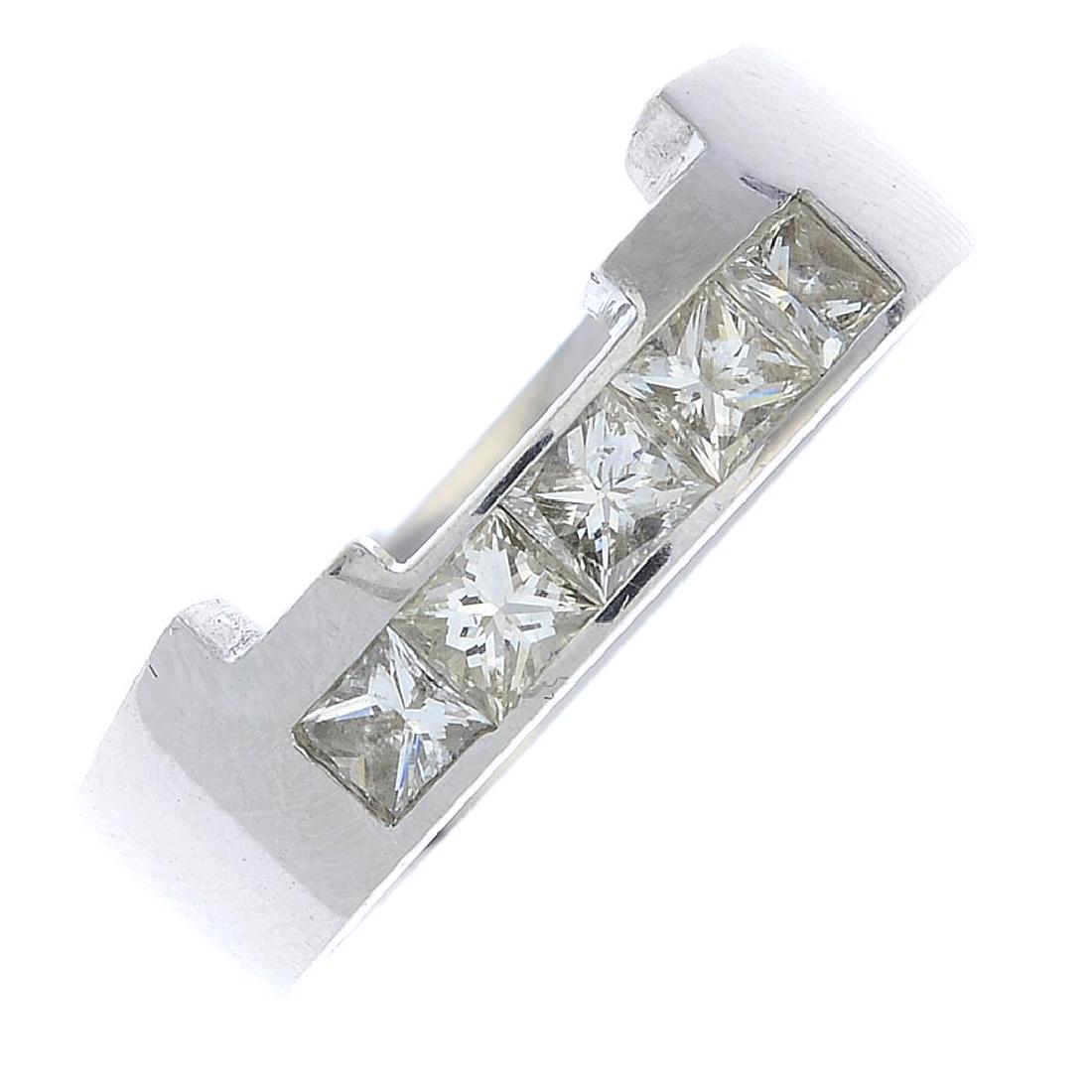 A platinum diamond band ring. Designed as a (1 of 3)