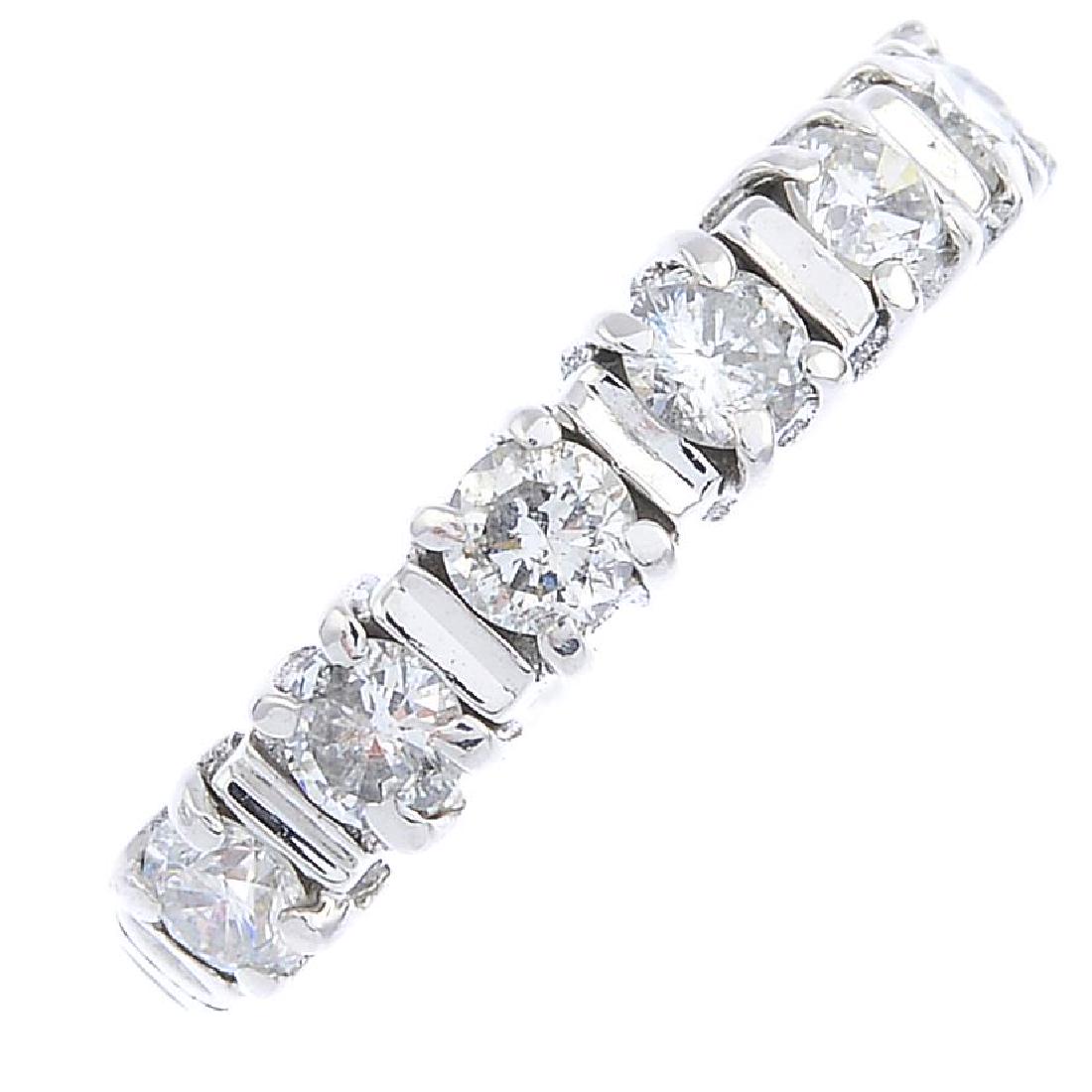 An 18ct gold diamond seven-stone ring. The (1 of 3)