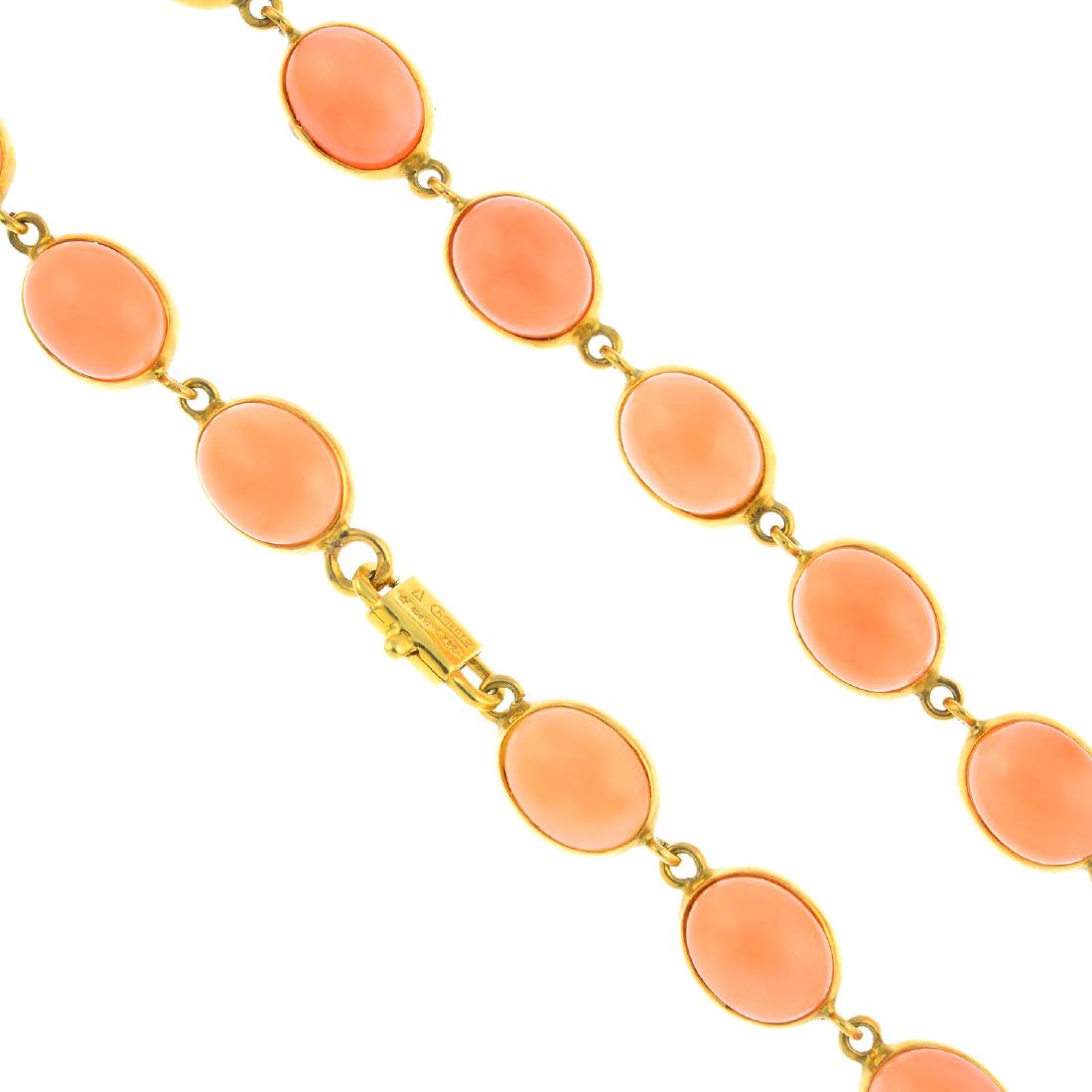 CHIMENTO - a coral necklace. The oval coral cabochon: CHIMENTO - a coral necklace. The oval coral cabochon collet links, to the spring-hook clasp. Signed Chimento. Italian marks. Length 43.7cms. Weight 27gms. Coral untested.