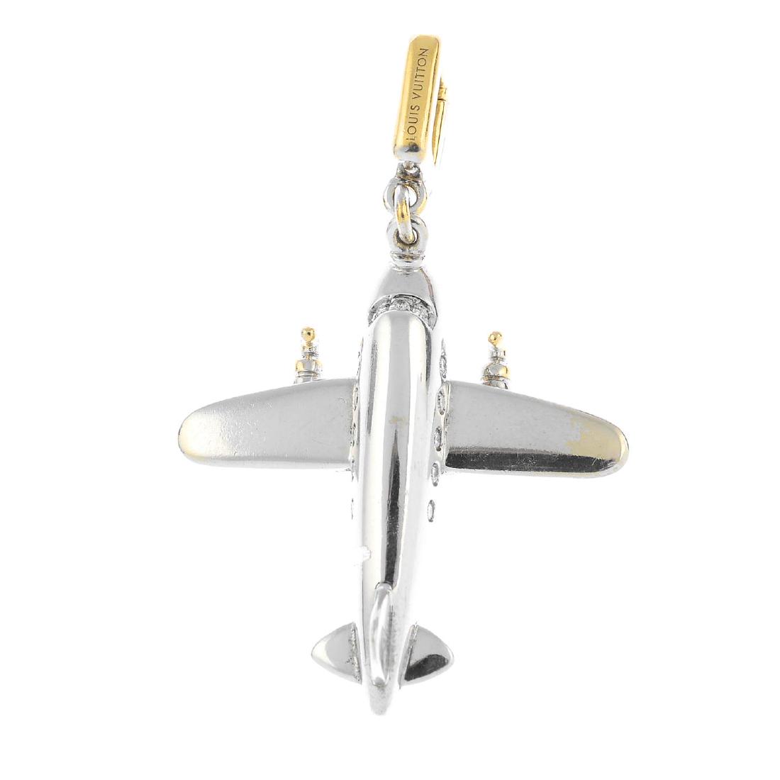 LOUIS VUITTON - an 18ct gold diamond airplane charm. Of (1 of 2)