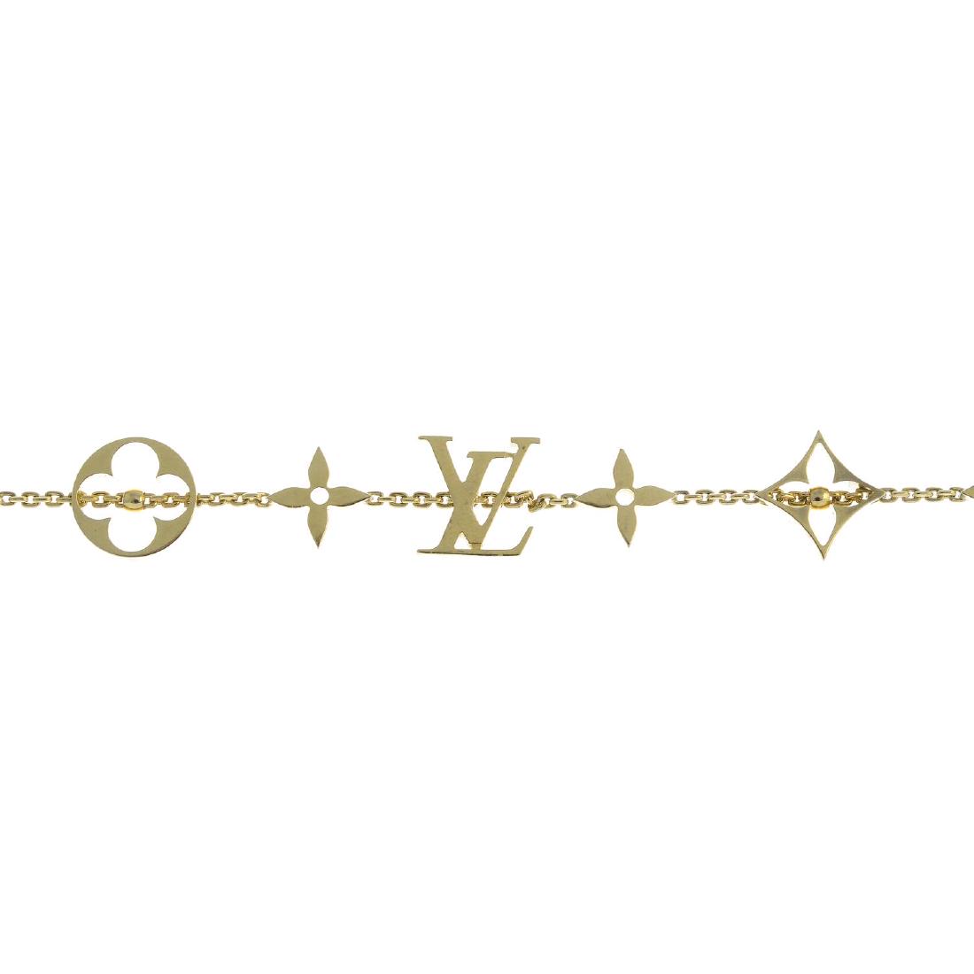 LOUIS VUITTON - an 18ct gold 'Monogram' bracelet. (1 of 3)