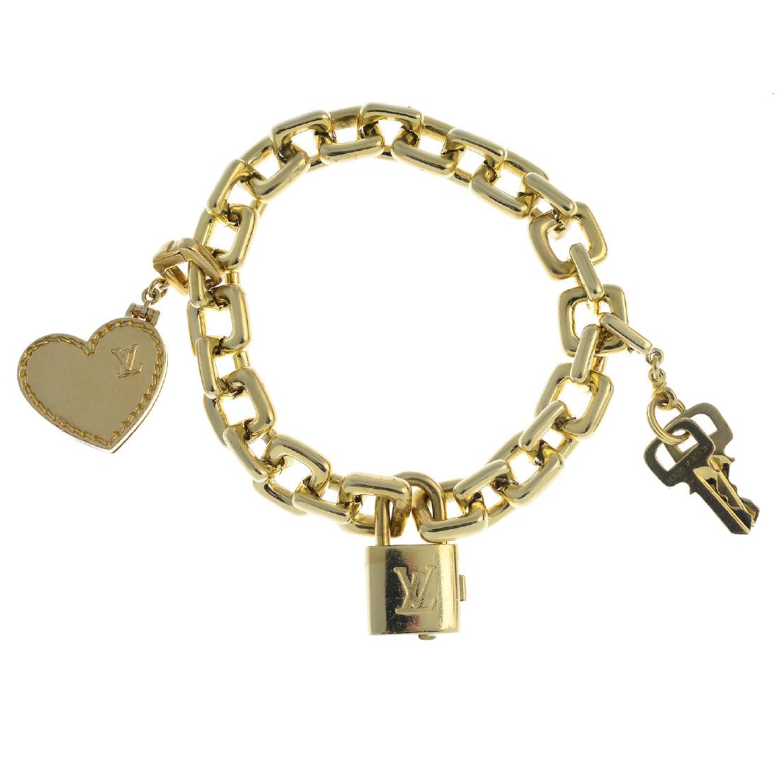 LOUIS VUITTON - an 18ct gold charm bracelet. The (1 of 2)