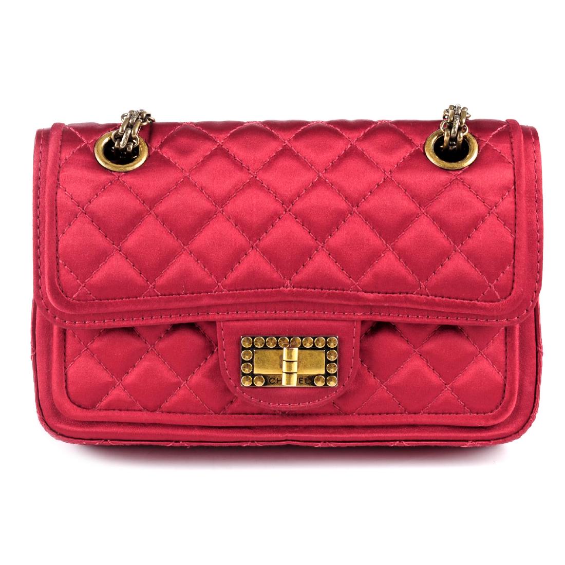 CHANEL - a small quilted red satin double flap handbag. (1 of 4)