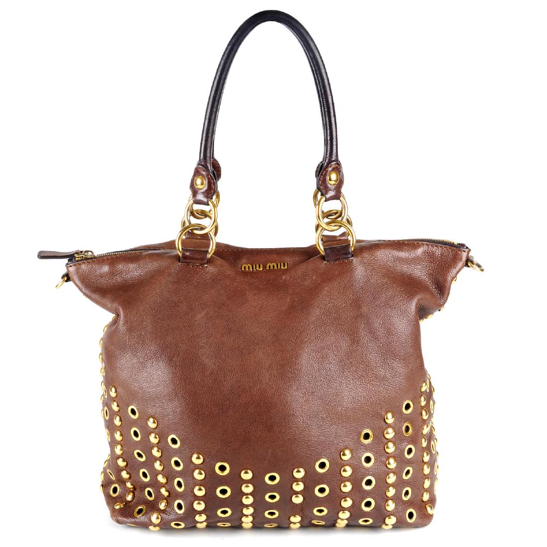 MIU MIU - a Stud & Grommet Cervo handbag. Crafted from (1 of 4)