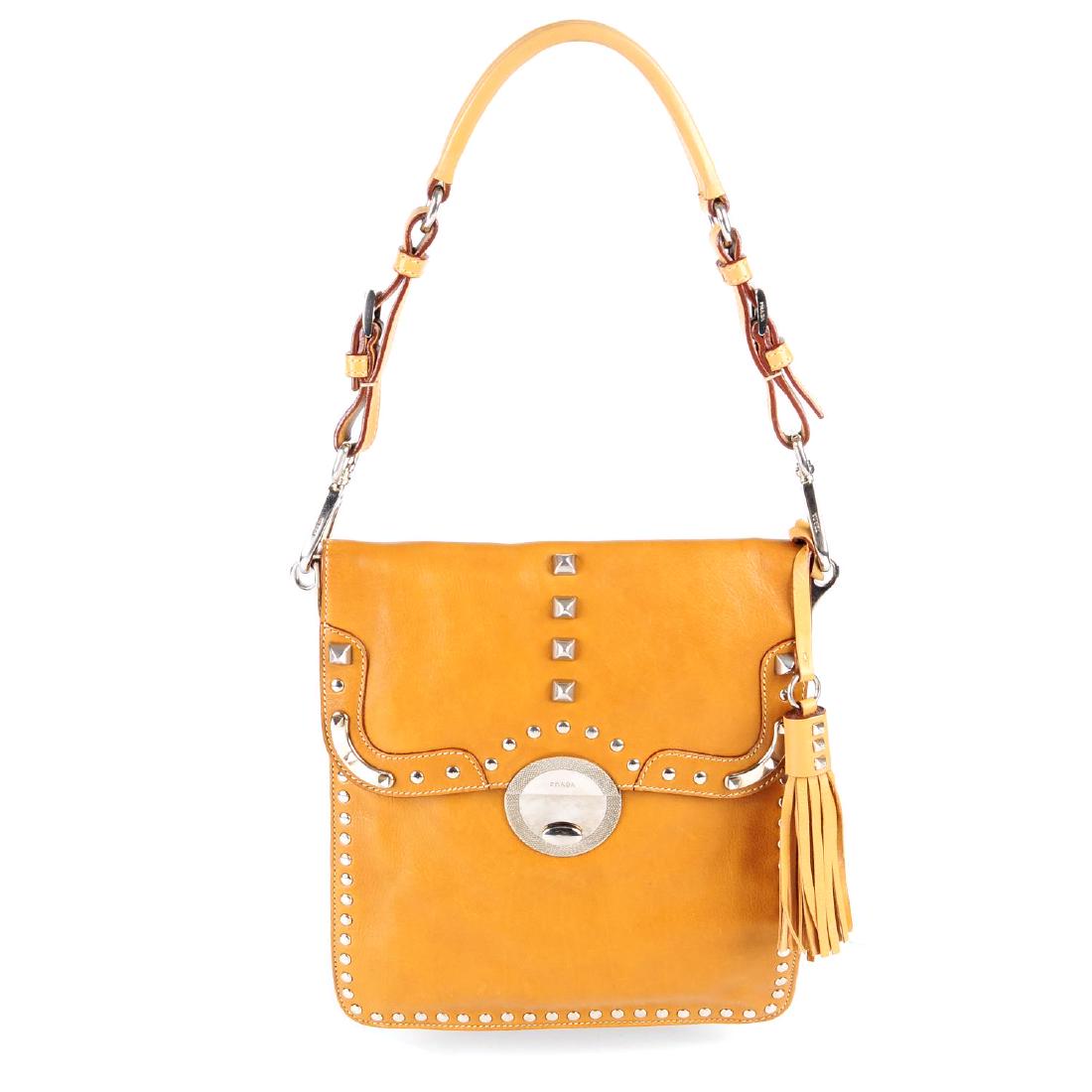 PRADA - a small studded handbag. Designed with a tan (1 of 4)