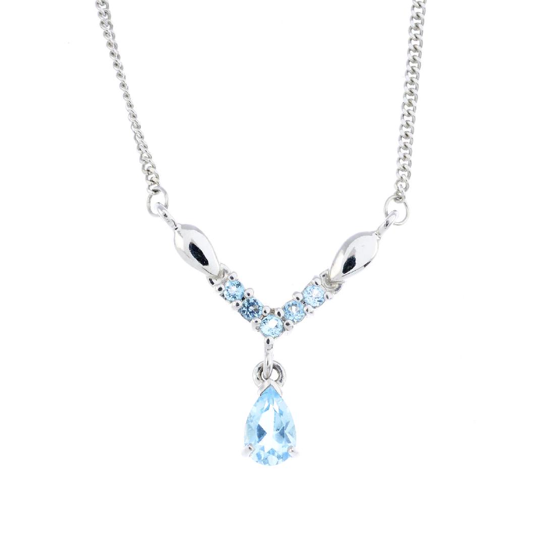 A 9ct gold aquamarine necklace. The pear-shape (1 of 2)