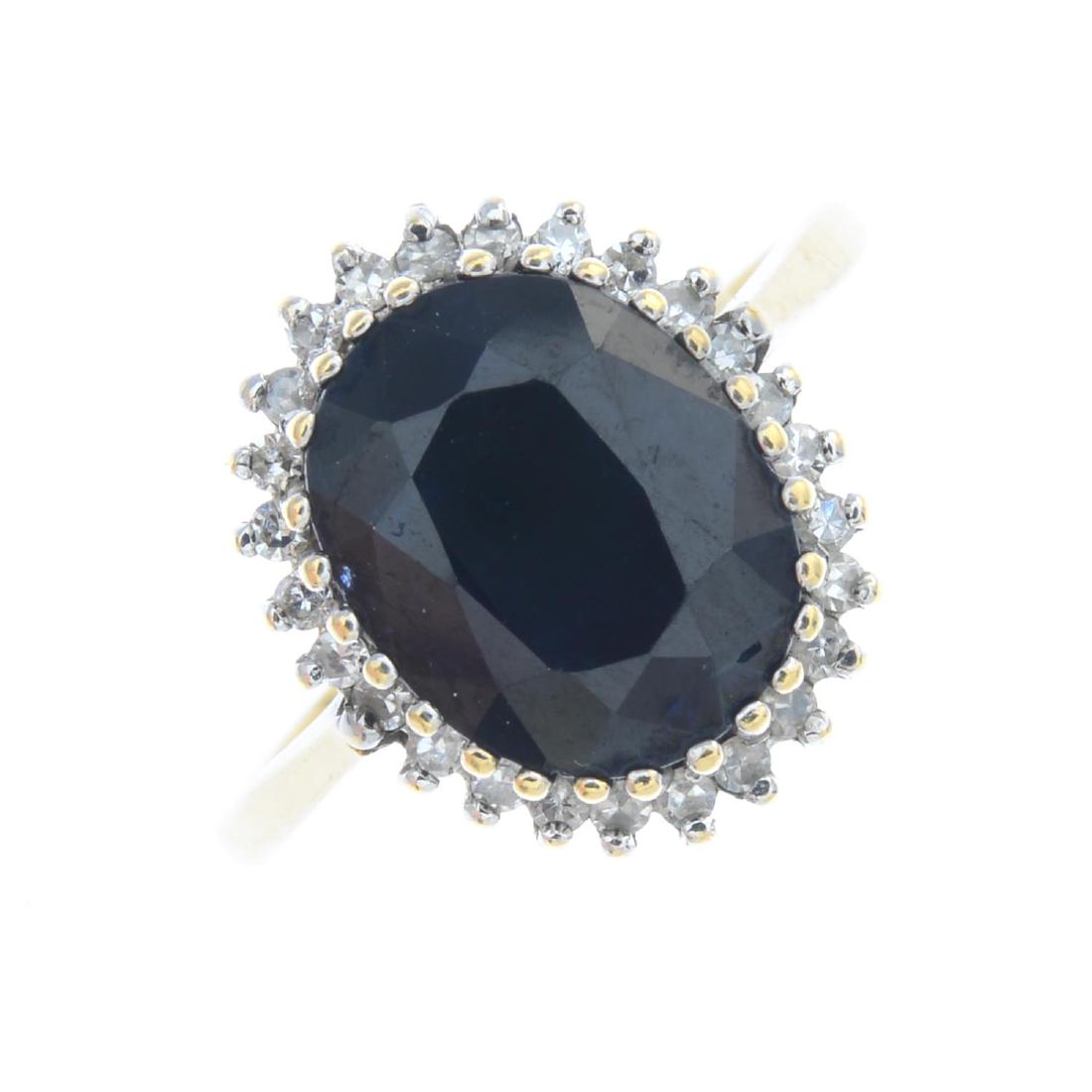 A 9ct gold sapphire and diamond cluster ring. The (1 of 3)