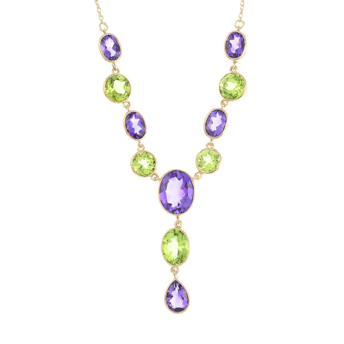 A 9ct gold peridot and amethyst necklace. The (1 of 2)