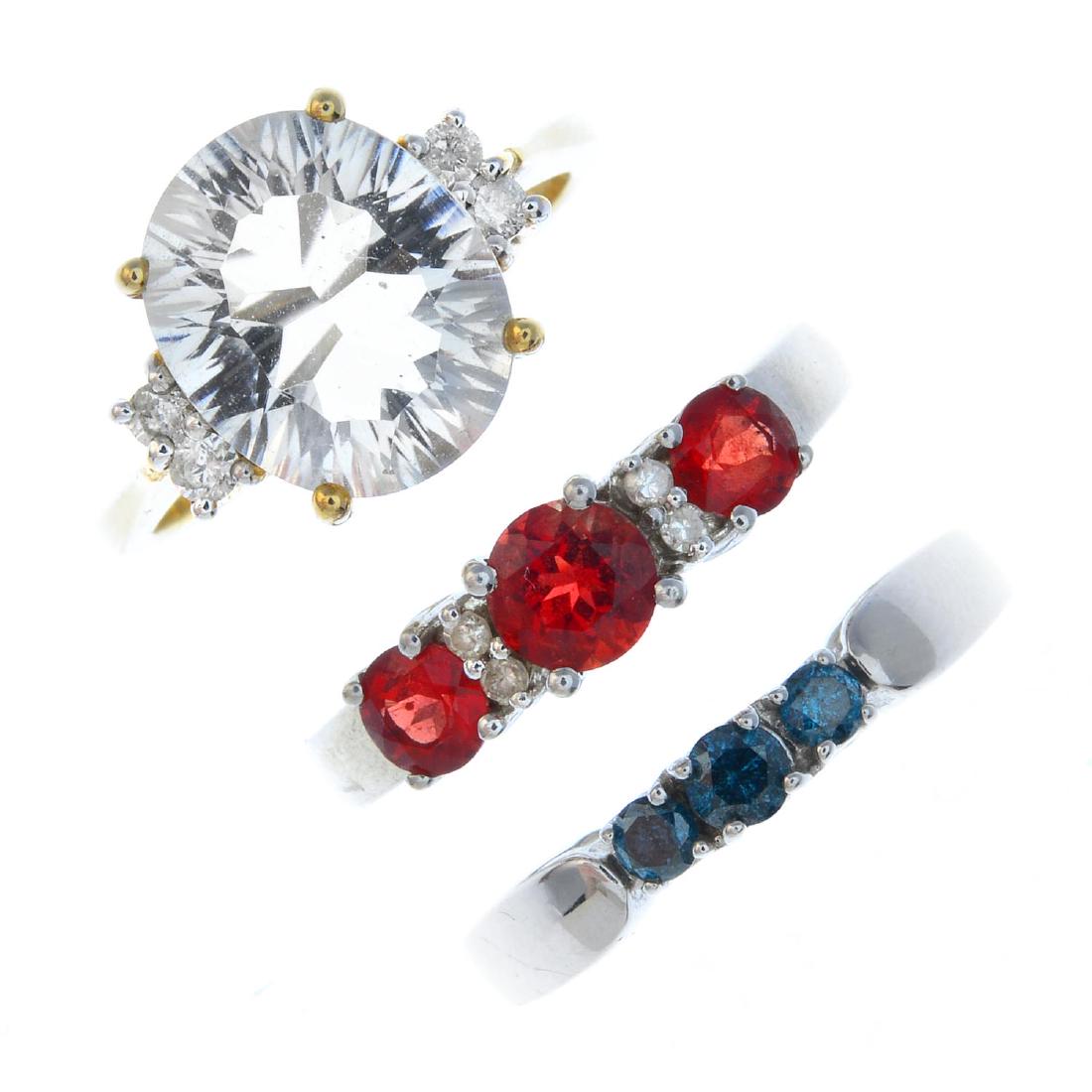 Four gem-set rings. To include a 9ct gold 'blue' (1 of 3)