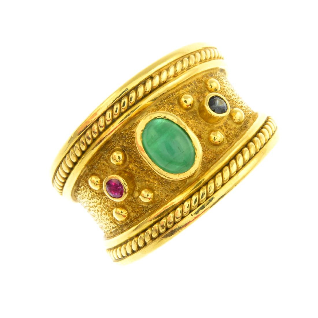 An 18ct gold gem-set ring. The oval emerald cabochon, (1 of 3)