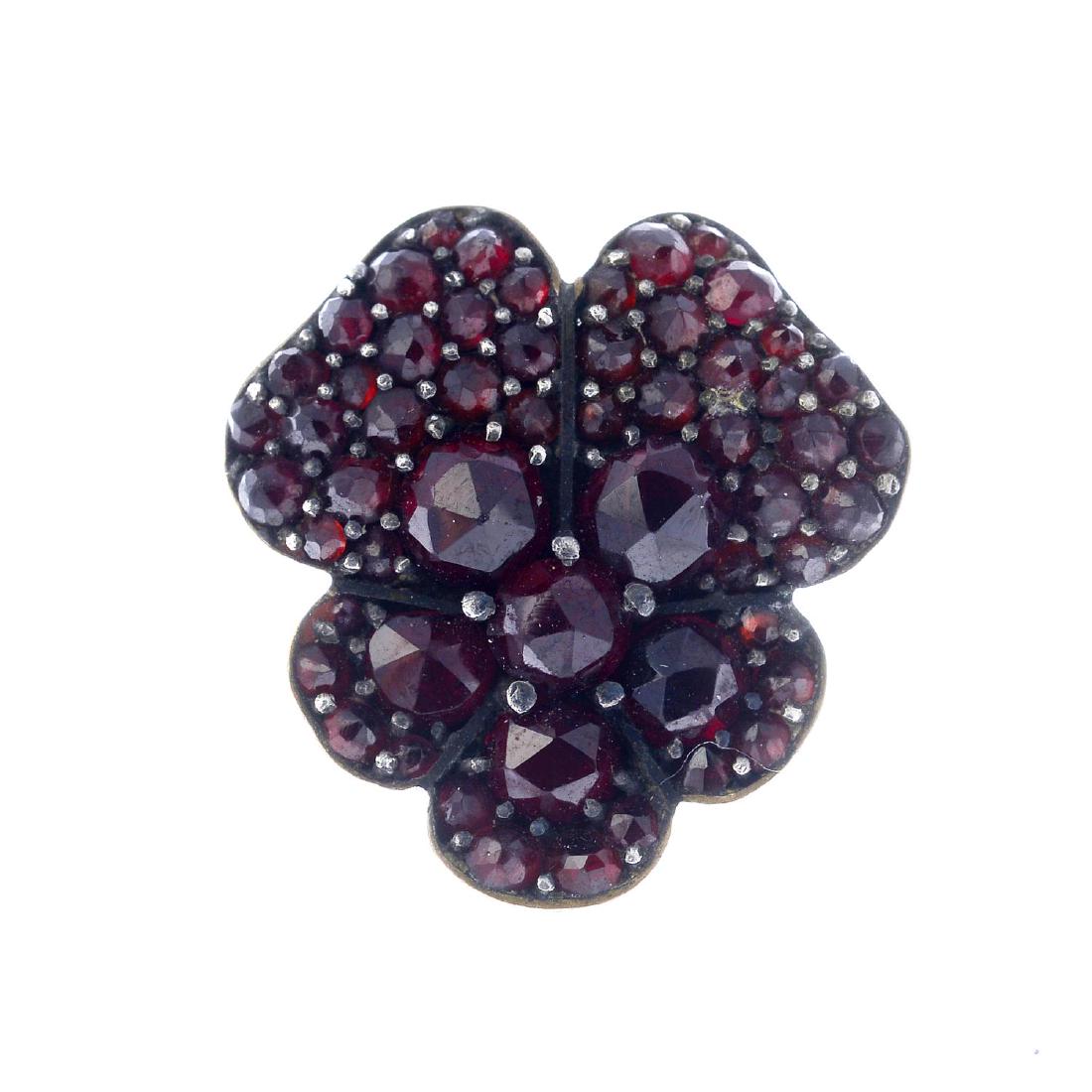 An early 20th century garnet brooch. Designed as a (1 of 2)