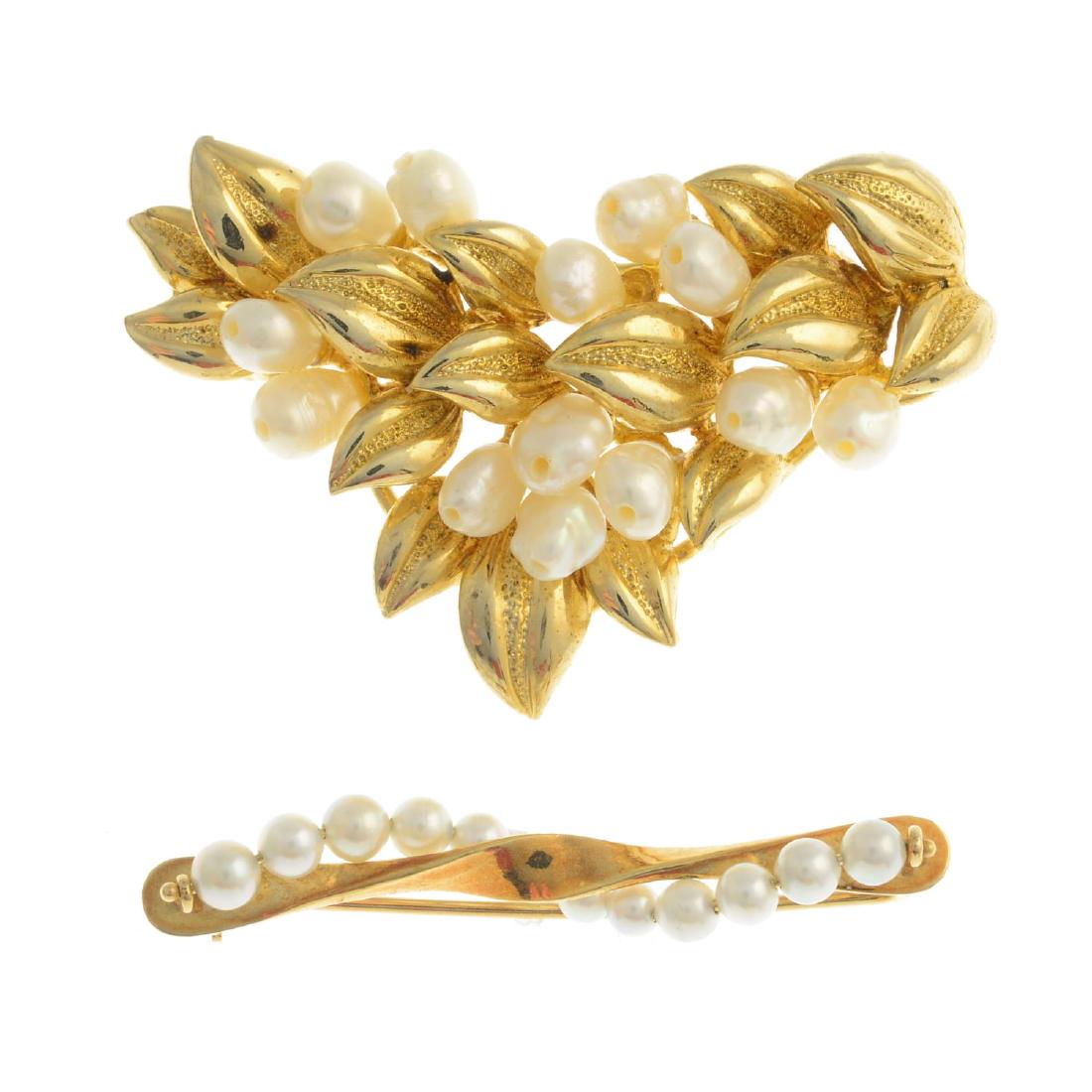 Two cultured pearl brooches. The first designed as a (1 of 2)