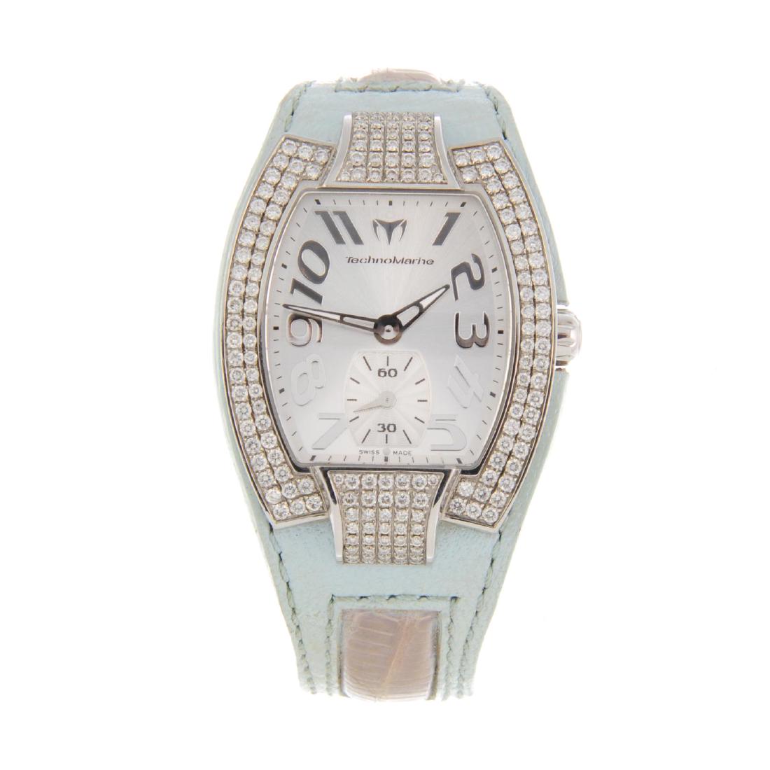 TECHNOMARINE - a lady's wrist watch. Stainless steel: TECHNOMARINE - a lady's wrist watch. Stainless steel case with factory diamond set bezel. Reference LR03323. Quartz movement. Silvered dial. Fitted to a signed light blue leather strap with stainless