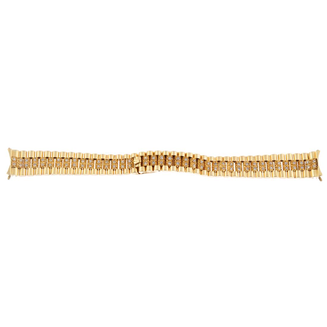 A yellow metal diamond set bracelet in the style of (1 of 2)