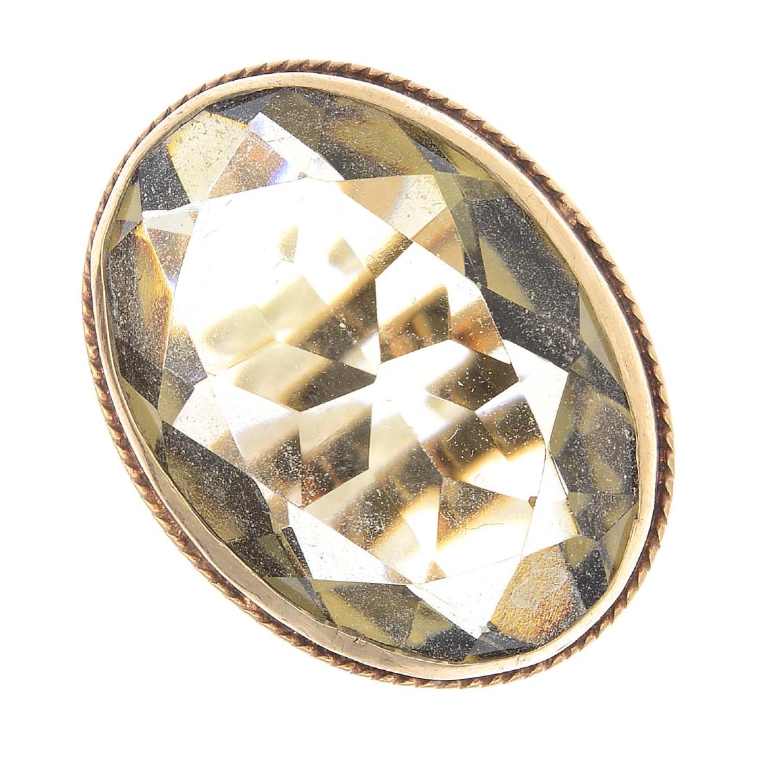 A 9ct gold citrine dress ring. The oval-shape citrine, (1 of 3)