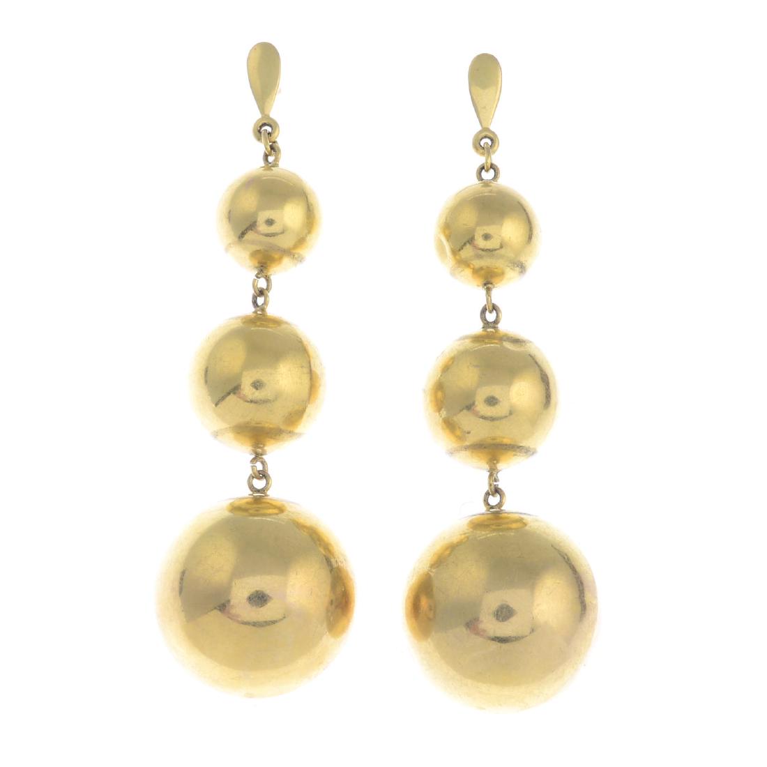 A pair of 9ct gold earrings. Each designed as three (1 of 2)