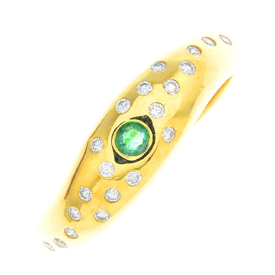 An 18ct gold emerald and diamond ring. The (1 of 3)