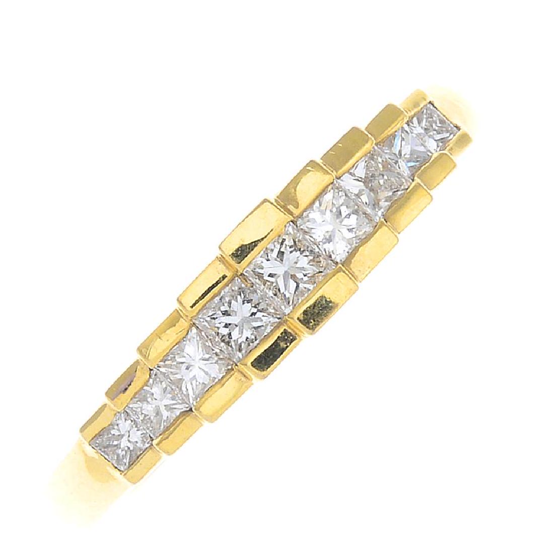 An 18ct gold diamond dress ring. The graduated (1 of 3)