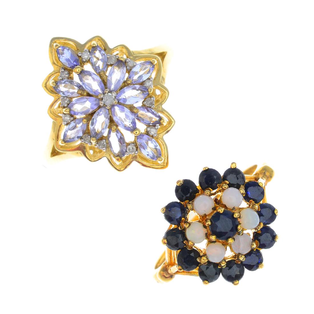 Four gem-set rings. To include a 9ct gold sapphire and (1 of 3)