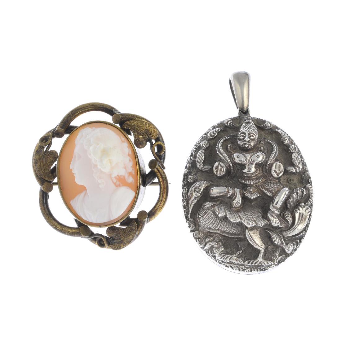 A late Victorian Indian silver locket and a base metal (1 of 3)
