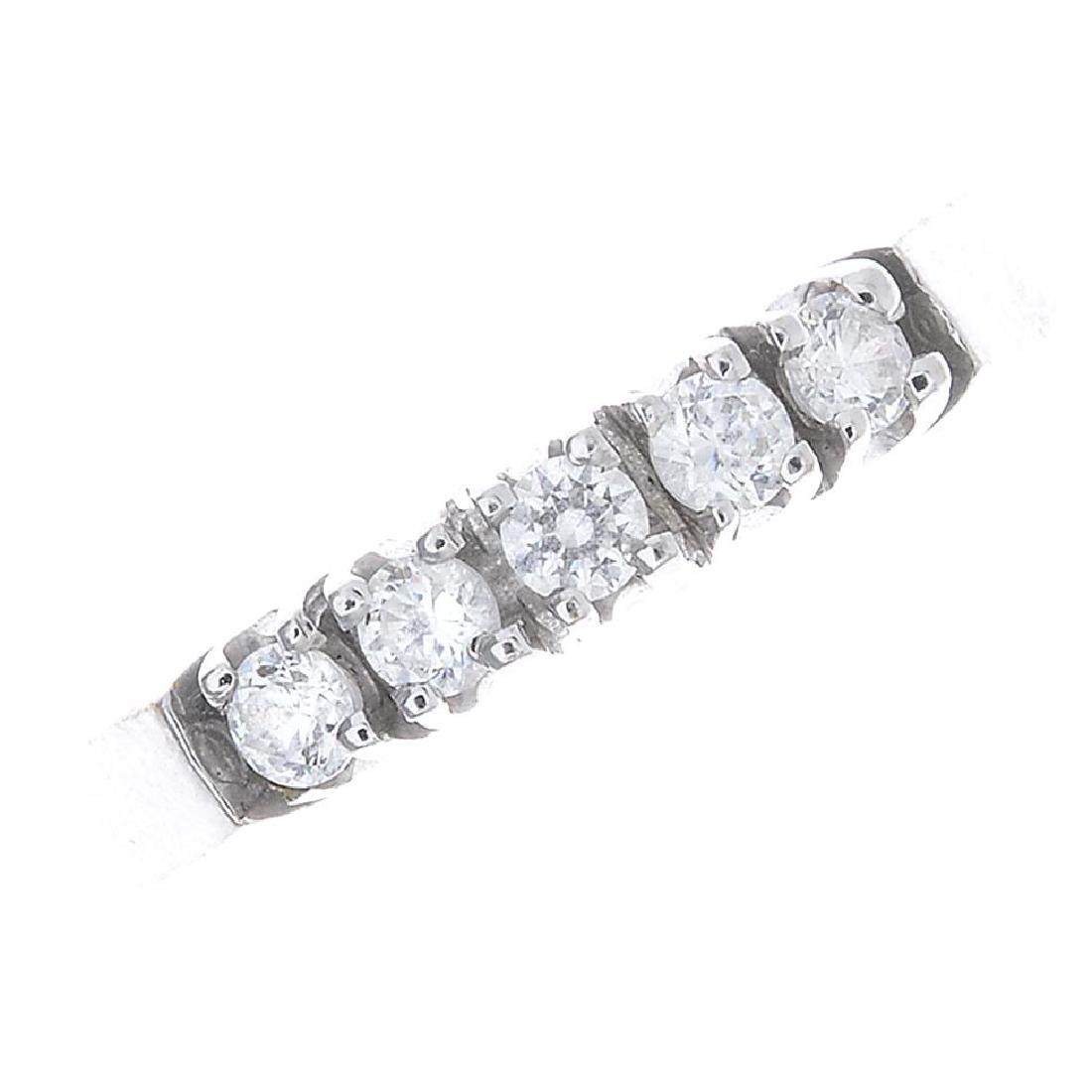 A cubic zirconia five-stone ring. The circular-shape (1 of 3)