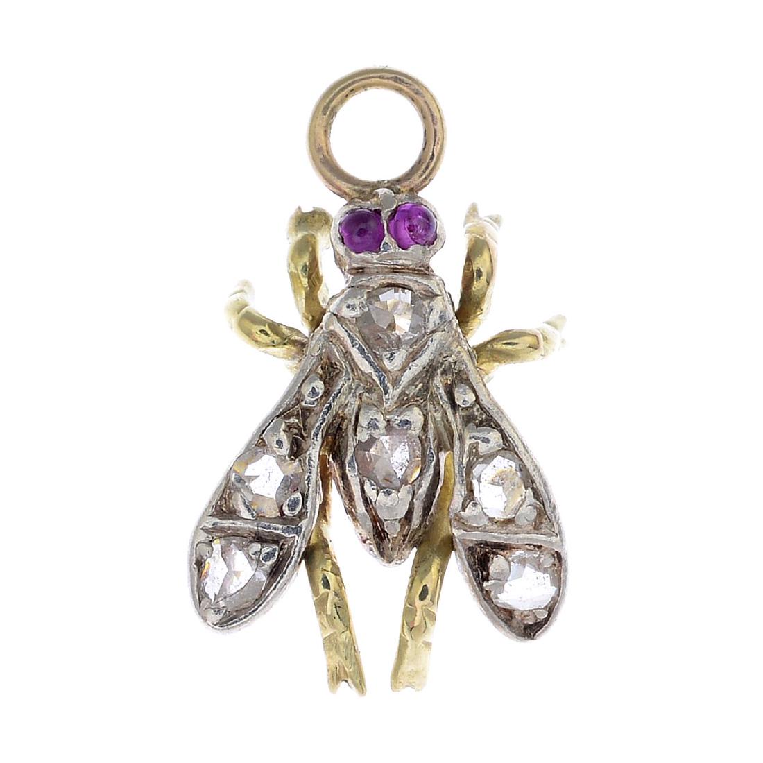 A diamond and ruby fly pendant. Designed as a fly, set (1 of 2)