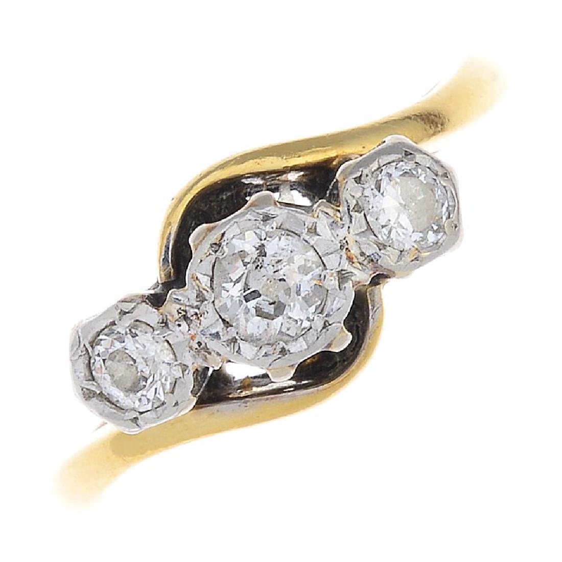 A diamond three-stone ring. The old-cut diamond (1 of 3)