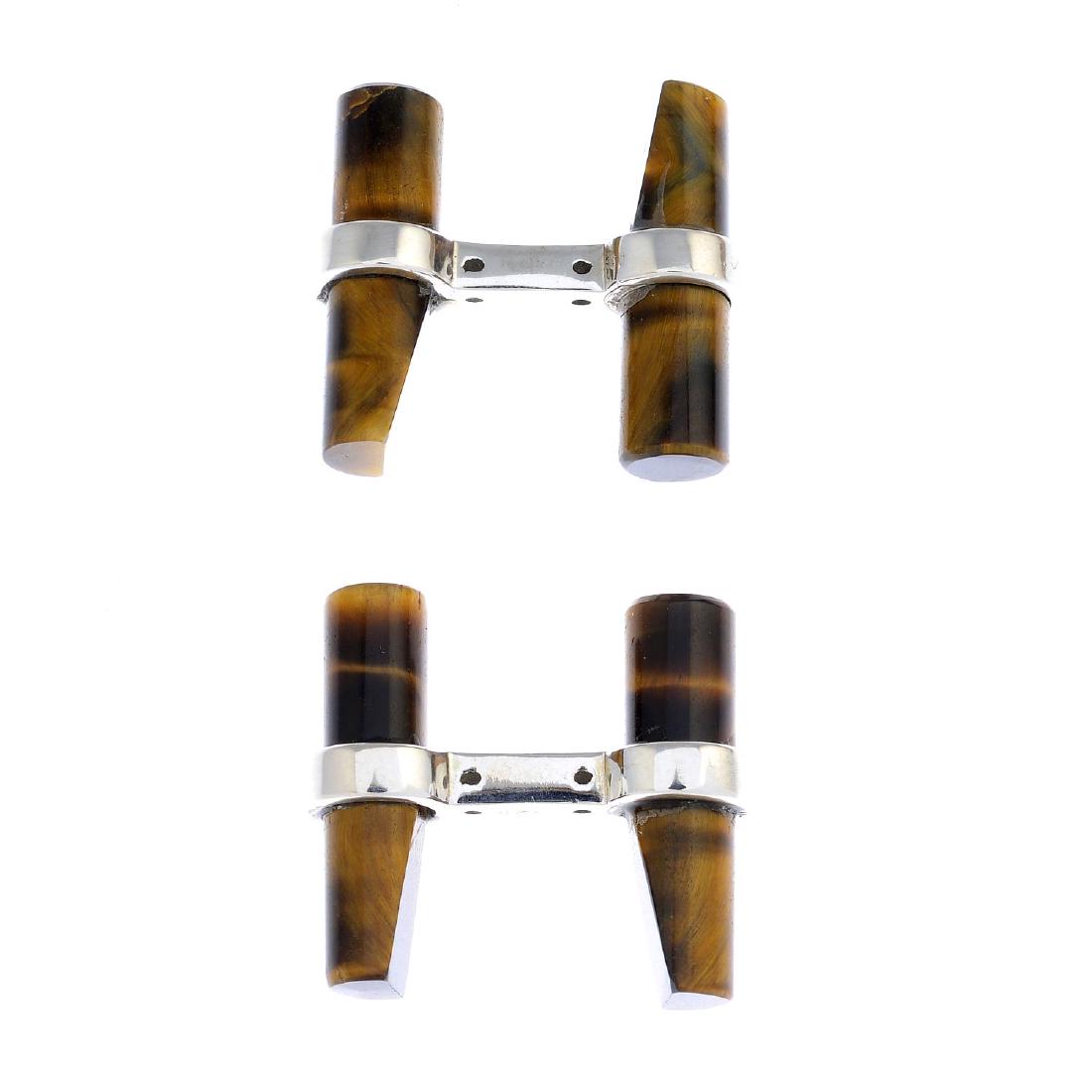 A pair of tiger's-eye cufflinks. Each designed as two (1 of 2)