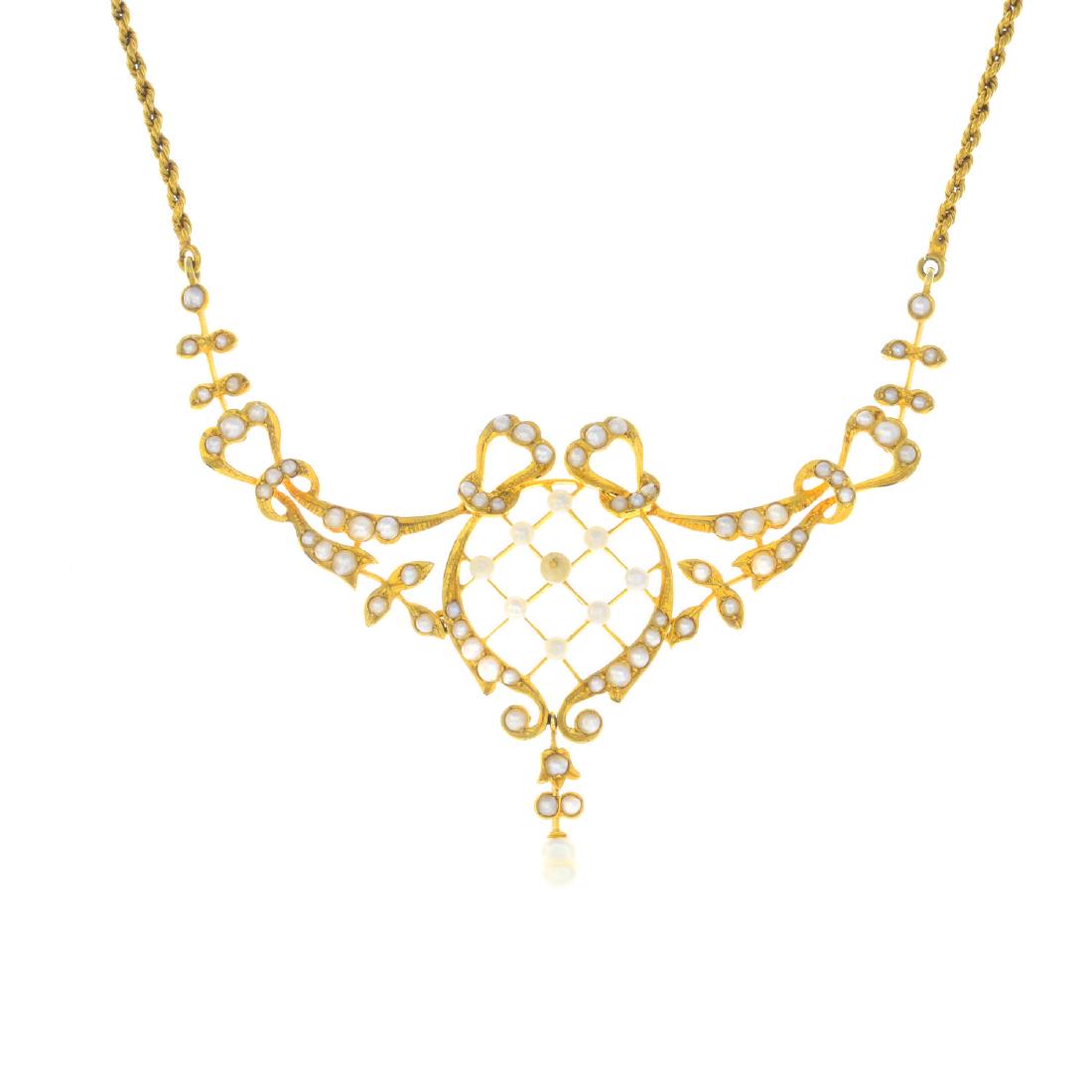 An early 20th century 15ct gold pearl, seed pearl and (1 of 2)