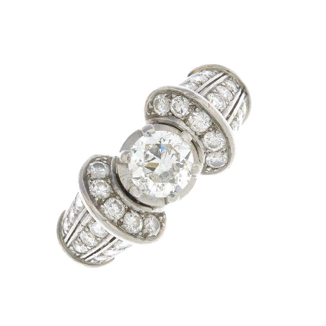 A mid 20th century platinum diamond dress ring. The (1 of 3)