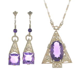 THEODOR FAHRNER - an early 20th century silver amethyst: THEODOR FAHRNER - an early 20th century silver amethyst and marcasite pendant and earrings. The pendant designed as an oval-shape amethyst and marcasite openwork geometric panel, suspended from an int