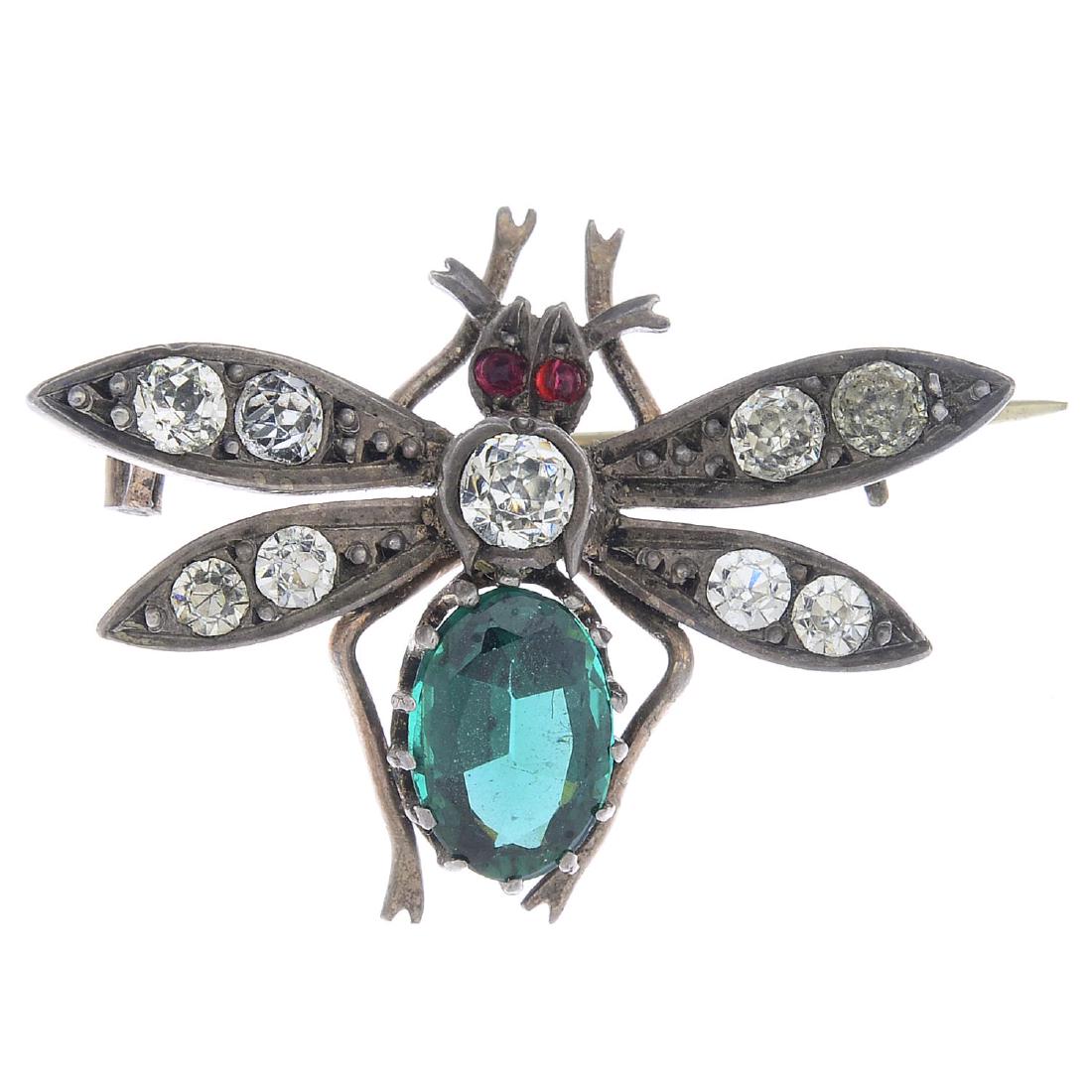 A gem-set brooch. Designed as a fly, with oval-shape (1 of 2)