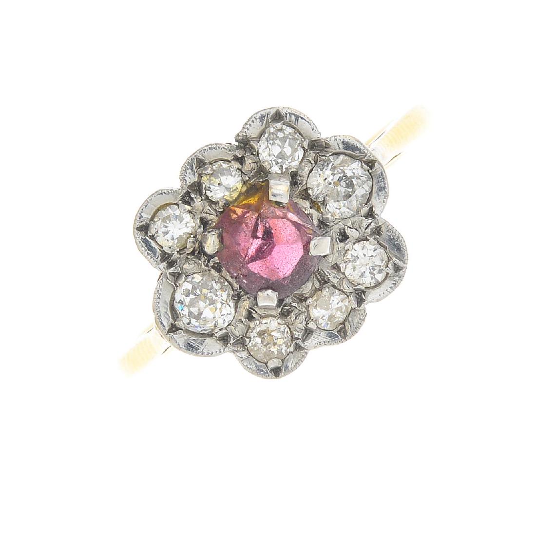 A garnet and diamond cluster ring. The cushion-shape (1 of 3)