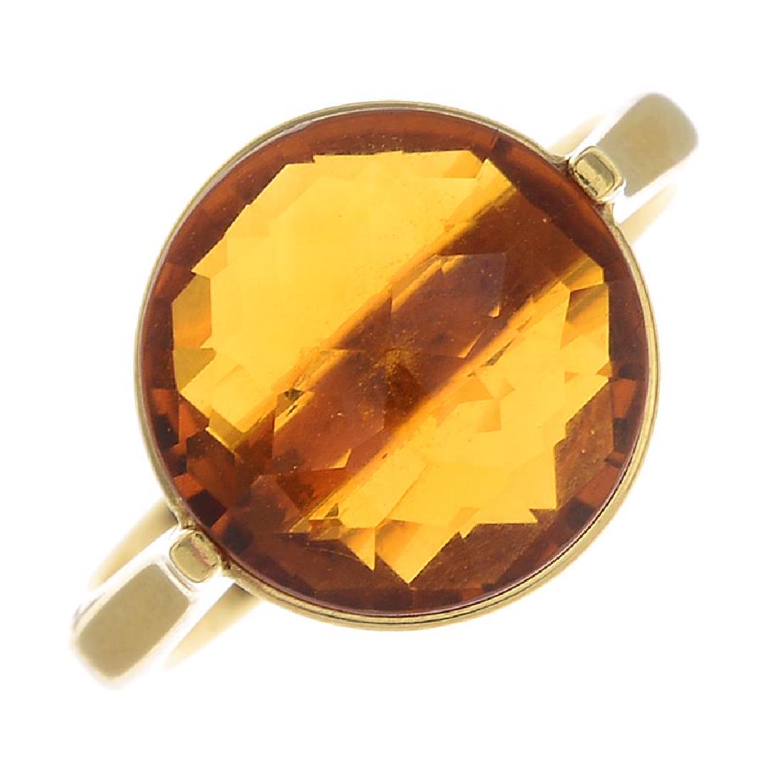 CHIMENTO - an 18ct gold citrine single-stone ring. The: CHIMENTO - an 18ct gold citrine single-stone ring. The circular-shape citrine, within a wire surround, to the tapered shoulders and band. Signed Chimento. Hallmarks for London, 2007. Ring size K1/2. W
