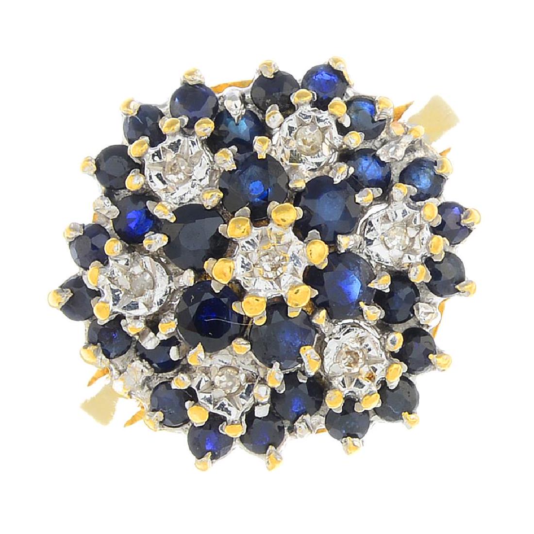 An 18ct gold sapphire and diamond dress ring. Designed (1 of 3)
