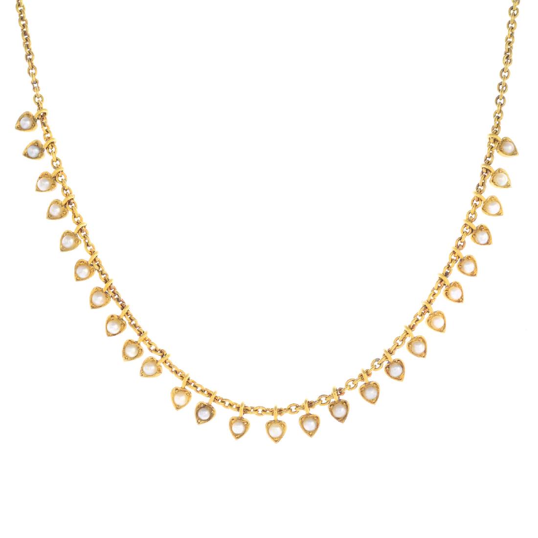 A split pearl necklace. The front designed as a split (1 of 3)