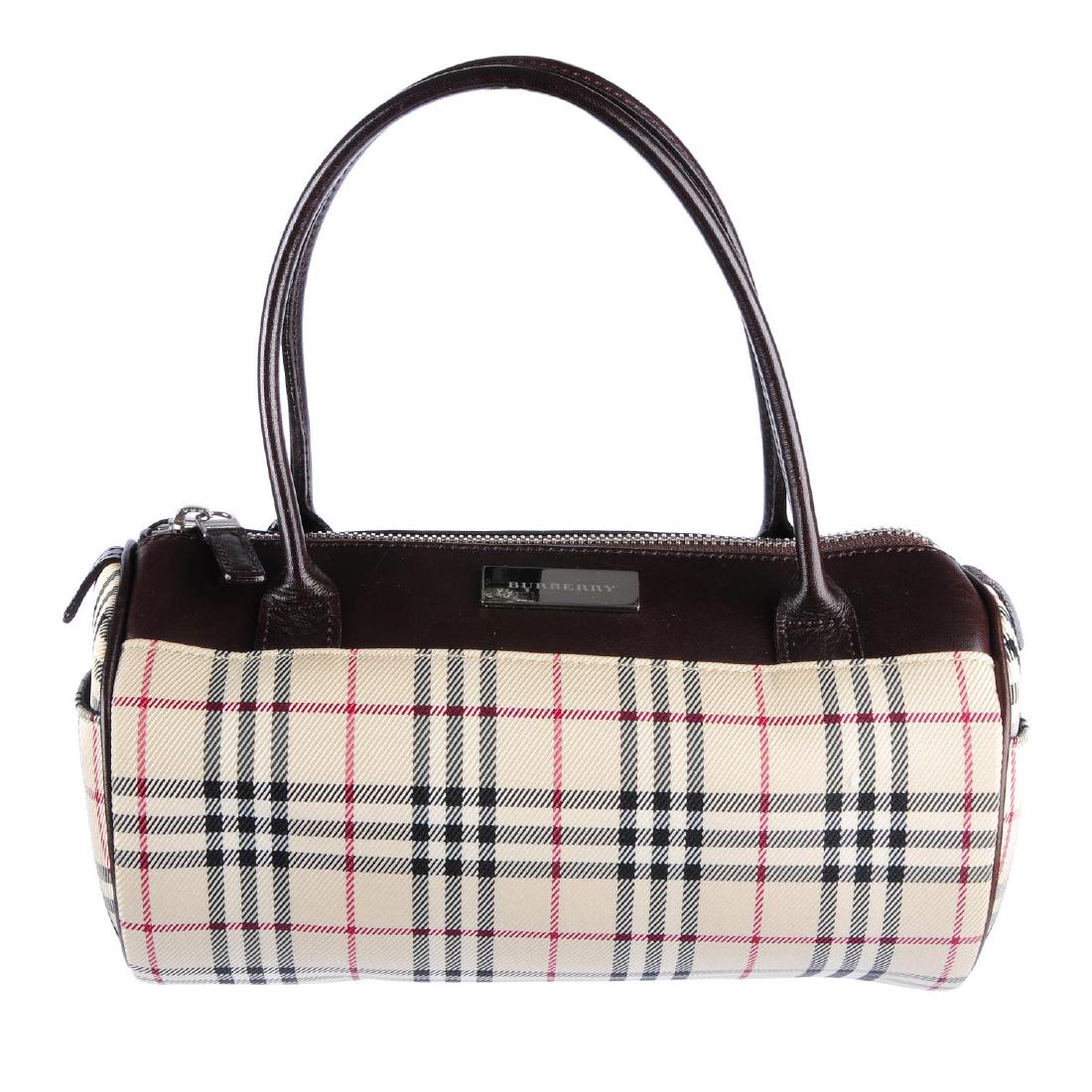 BURBERRY - a small barrel handbag. Designed with (1 of 3)