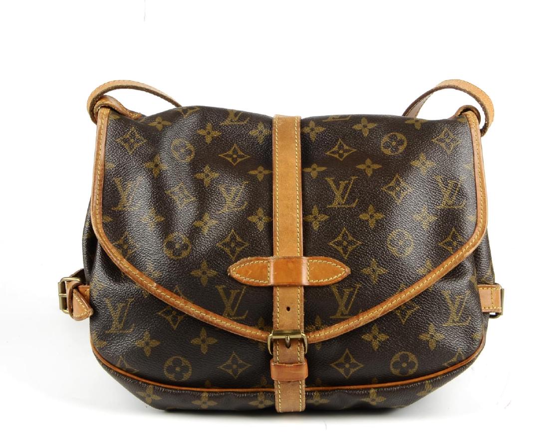 LOUIS VUITTON - a Monogram Saumur 25 handbag. Crafted (1 of 5)