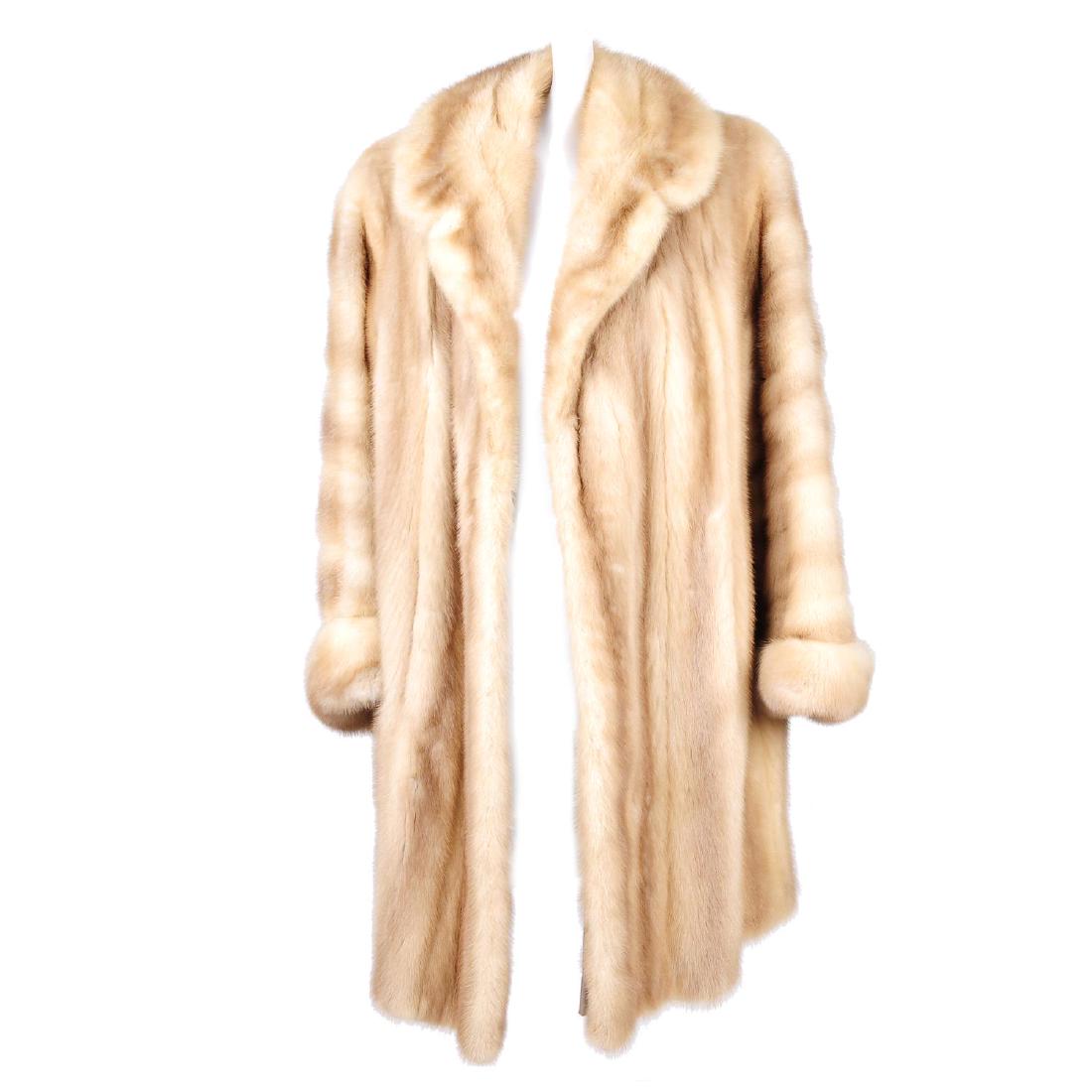 A dawn pastel mink coat. Designed with a notched lapel (1 of 3)
