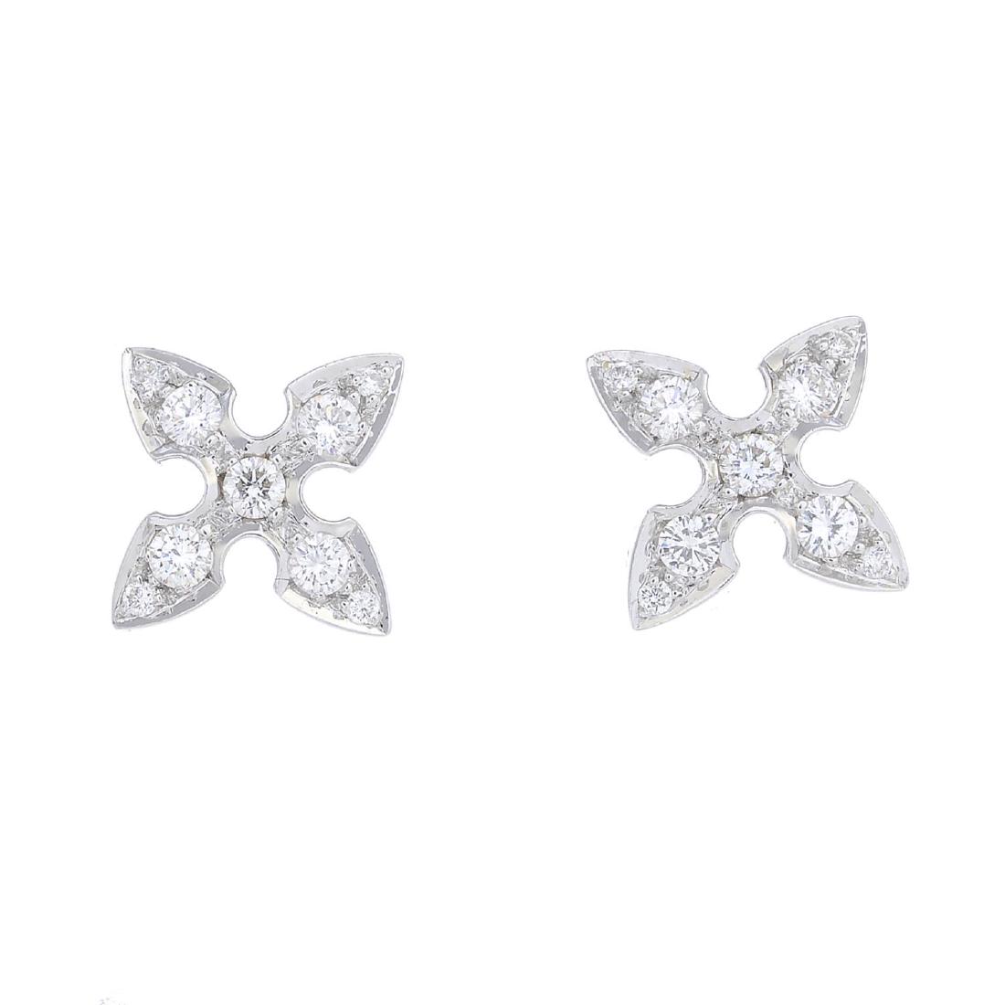 STEPHEN WEBSTER - a pair of 18ct gold diamond floral: STEPHEN WEBSTER - a pair of 18ct gold diamond floral stud earrings. Each designed as a brilliant-cut diamond, each within a similarly-cut diamond petal surround. Makers marks for Stephen Webster, Lond
