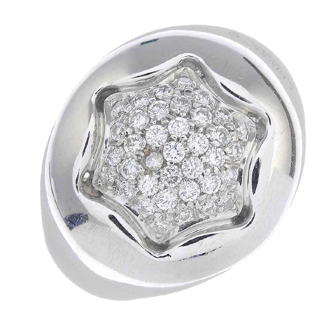 CHIMENTO - an 18ct gold diamond ring. Designed as a: CHIMENTO - an 18ct gold diamond ring. Designed as a pave-set diamond star, inset to the tapered band. Signed Chimento. Estimated total diamond weight 0.40ct. Italian marks. Ring size Q. Weight 9.5gms.