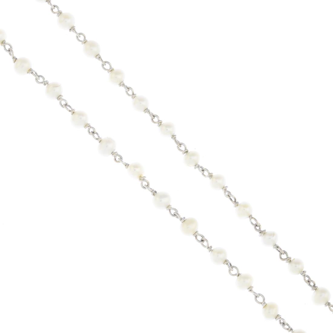 An 18ct gold seed pearl necklace. Designed as a seed: An 18ct gold seed pearl necklace. Designed as a seed pearl line, measuring approximately 3.7 to 3.2mms. French assay marks. Length 51cms. Weight 6.8gms.