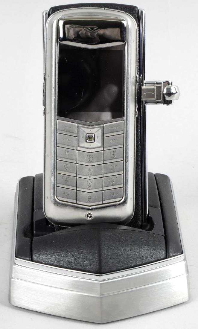 A Vertu mobile phone, stand and accessories, together: A Vertu mobile phone, stand and accessories, together with a selection of Cartier pen refills.