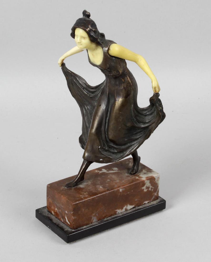 A bronzed figure, modelled as an Art Deco lady, upon: A bronzed figure, modelled as an Art Deco lady, upon rouge marble and black marble stepped plinth, 7.75 (19.5cm) high.