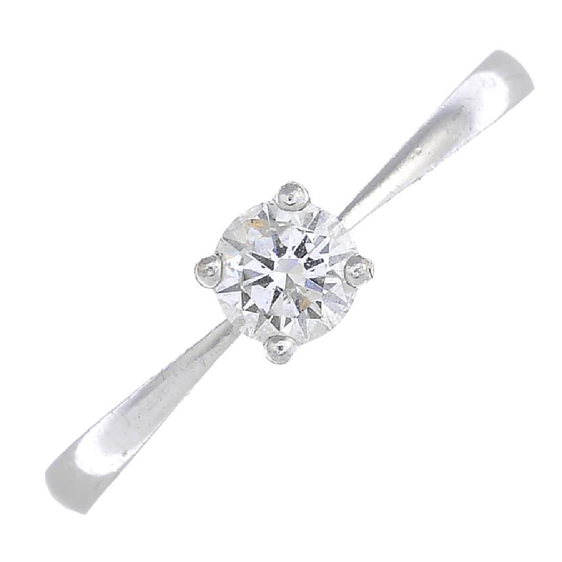 An 18ct gold diamond single-stone ring. The (1 of 3)