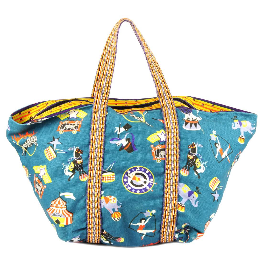 MISSONI - a canvas Circus Tote handbag. Designed with a: MISSONI - a canvas Circus Tote handbag. Designed with a multicoloured canvas exterior with printed circus symbols throughout, with woven wraparound straps and top handles, a zip fastening and one inte