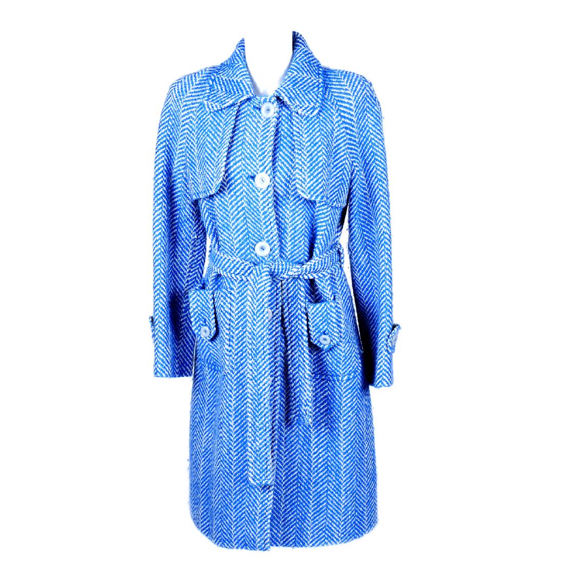 MISSONI - a blue and white three-quarter length: MISSONI - a blue and white three-quarter length wool-blend coat. Designed with a blue and white herringbone patterned exterior, featuring a lapel collar, front button fastenings and two outer pockets,