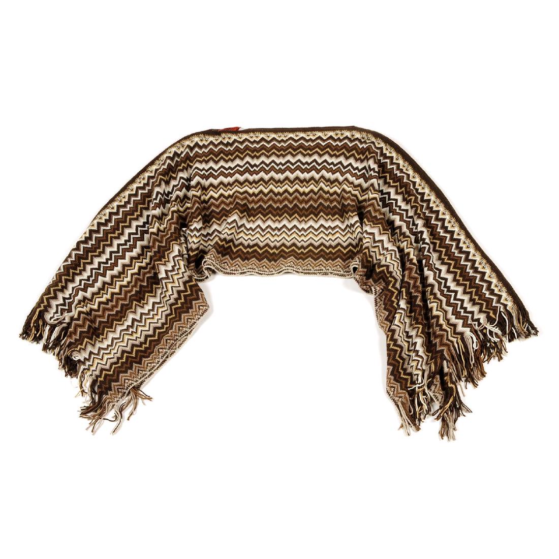 MISSONI - a poncho. Featuring maker's brown and white: MISSONI - a poncho. Featuring maker's brown and white classic zig-zag woven pattern and two fringed edges. Labelled Missoni. One size.