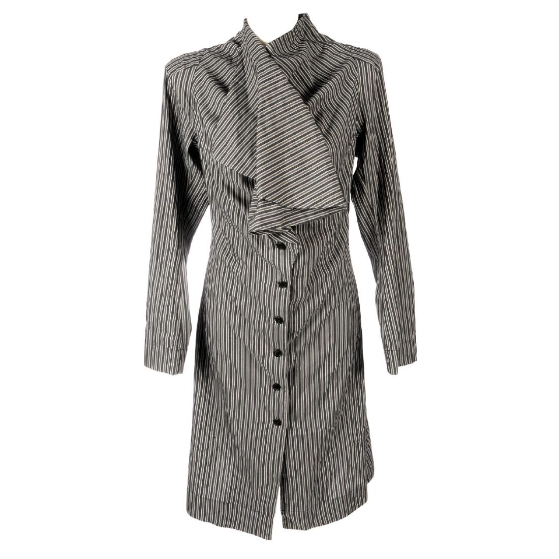 VIVIENNE WESTWOOD - a striped shirt dress. Designed: VIVIENNE WESTWOOD - a striped shirt dress. Designed with long sleeves, full-length button fastening and a gathered ruffle detail to the front. Labelled Vivienne Westwood, size 40.