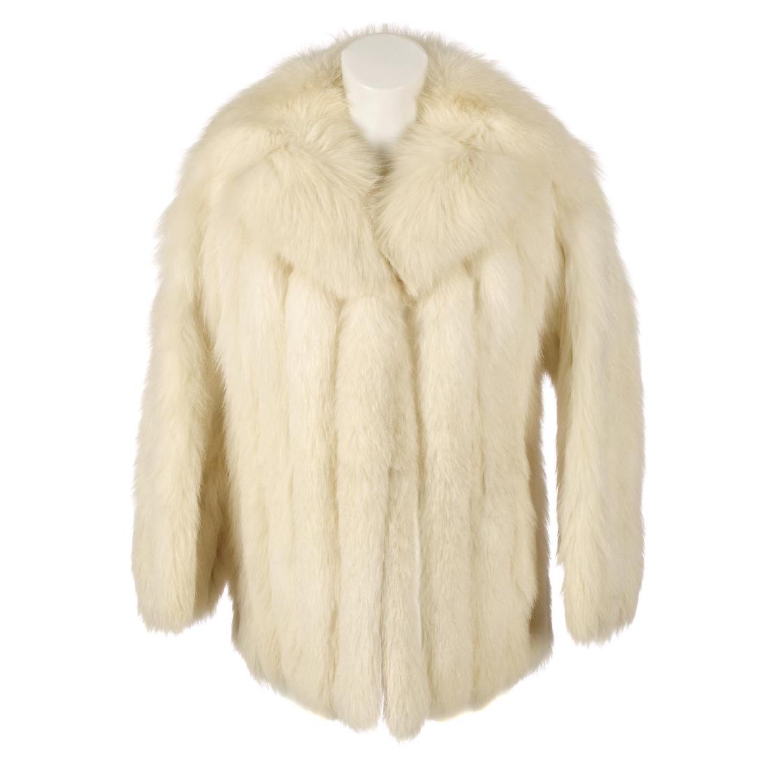 An arctic fox fur jacket. Designed with a notched lapel: An arctic fox fur jacket. Designed with a notched lapel collar, hook and eye clip fastenings, two outer pockets and an inner side pocket. Labelled size 8. Chest measures approximately 36inches.